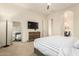 Relaxing main bedroom boasts plush bedding, modern furnishings, and ceiling fan at 12031 S 184Th Ave, Goodyear, AZ 85338