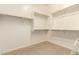 Walk-in closet featuring built-in shelving and ample storage space at 12031 S 184Th Ave, Goodyear, AZ 85338