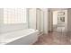 Bright bathroom with soaking tub, sliding glass shower doors, and a glass block window at 1211 W Hawken Way, Chandler, AZ 85286