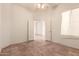 Bedroom with ceramic tile flooring, a ceiling fan and entry doors at 1211 W Hawken Way, Chandler, AZ 85286