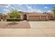 Charming single-story home with a three-car garage and well-maintained desert landscaping at 1211 W Hawken Way, Chandler, AZ 85286