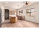 Bright eat-in kitchen with stainless appliances, wood cabinets, and lots of natural light at 1211 W Hawken Way, Chandler, AZ 85286