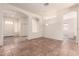 Bright living room features neutral walls, tiled floor, and arched doorways providing open flow at 1211 W Hawken Way, Chandler, AZ 85286