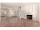 Spacious living room with fireplace, neutral walls, and arched doorways, creating an inviting atmosphere at 1211 W Hawken Way, Chandler, AZ 85286