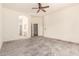 Open main bedroom with ceramic tile flooring and views to bathroom and closet at 1211 W Hawken Way, Chandler, AZ 85286