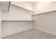 Walk-in closet with carpet and built-in shelving for ample storage and organization at 1211 W Hawken Way, Chandler, AZ 85286