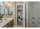 Bathroom vanity leading to the bedroom with natural light and open space at 1367 S Country Club Dr # 1189, Mesa, AZ 85210
