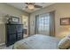 Comfortable bedroom with ceiling fan and large window offering natural light at 1367 S Country Club Dr # 1189, Mesa, AZ 85210