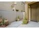 Private courtyard with neutral-toned walls and landscaping, providing a tranquil outdoor space at 1367 S Country Club Dr # 1189, Mesa, AZ 85210