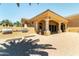 Stunning outdoor patio with covered area, featuring stone columns, built-in grill, and ample space for entertaining at 1367 S Country Club Dr # 1189, Mesa, AZ 85210