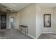 Upstairs hallway with art decorations and a view of the secondary bedroom at 1367 S Country Club Dr # 1189, Mesa, AZ 85210