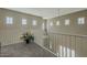 Hallway landing featuring neutral tones and a view to the first floor at 1367 S Country Club Dr # 1189, Mesa, AZ 85210