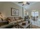 Bright and airy living room with a comfortable sofa and view to the dining area at 1367 S Country Club Dr # 1189, Mesa, AZ 85210