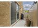 Outdoor patio with a grill, desert landscape, and privacy fence at 1367 S Country Club Dr # 1189, Mesa, AZ 85210