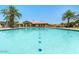 Sparkling swimming pool with clear blue water and surrounding lounge chairs, perfect for relaxing and enjoying the sun at 1367 S Country Club Dr # 1189, Mesa, AZ 85210