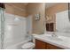 Full bathroom features a tub and shower combination at 14239 W Port Royale Ln, Surprise, AZ 85379
