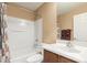 Full bathroom has a shower-tub combination, a toilet, and a vanity with sink at 14239 W Port Royale Ln, Surprise, AZ 85379
