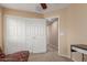 Bedroom featuring carpet, a closet with sliding doors, and an open doorway at 14239 W Port Royale Ln, Surprise, AZ 85379