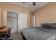 Spacious bedroom with a closet and an additional door to a hallway at 14239 W Port Royale Ln, Surprise, AZ 85379