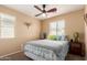 Inviting bedroom with two windows providing natural light and stylish decorations at 14239 W Port Royale Ln, Surprise, AZ 85379