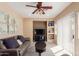 Cozy living room featuring neutral color palette, built-in shelves, and plush seating at 14239 W Port Royale Ln, Surprise, AZ 85379