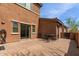 Private brick-paved patio with outdoor dining area, perfect for entertaining or relaxing at 14239 W Port Royale Ln, Surprise, AZ 85379