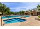 Sparkling community pool with a hot tub and comfortable lounge chairs at 14239 W Port Royale Ln, Surprise, AZ 85379