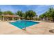 Community pool featuring lounge chairs and a shaded pavilion at 14239 W Port Royale Ln, Surprise, AZ 85379