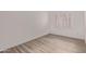 Bedroom featuring modern floors, neutral walls, and window with shutters at 14722 W Lucas Ln, Surprise, AZ 85374