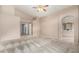 Large main bedroom offering plush carpeting, neutral tones, and an en-suite bathroom at 15328 W Memory Ln, Surprise, AZ 85374