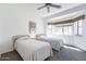 Well-lit bedroom featuring two beds, neutral walls, and a ceiling fan at 1539 E Brenda Dr, Casa Grande, AZ 85122