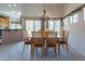 Dining room showcasing an elegant chandelier, wood table and seating with a view to an outdoor area at 1539 E Brenda Dr, Casa Grande, AZ 85122