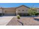 Charming single-story home with a well-maintained desert landscape and a neutral-toned exterior at 1539 E Brenda Dr, Casa Grande, AZ 85122