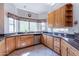 Bright kitchen featuring light wood cabinets, granite countertops, stainless steel appliances, and a large bay window at 1539 E Brenda Dr, Casa Grande, AZ 85122