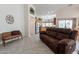 Open-concept living space with kitchen and living room, featuring tile floors and neutral decor at 1539 E Brenda Dr, Casa Grande, AZ 85122