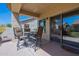 Covered patio with a dining set, perfect for outdoor entertaining at 1539 E Brenda Dr, Casa Grande, AZ 85122