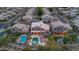 Aerial view of houses with pools, spas, firepit and outdoor kitchen in a residential neighborhood at 15413 S 31St Pl, Phoenix, AZ 85048