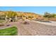 Backyard featuring a pool, spa, lounge seating, and desert mountain views at 15413 S 31St Pl, Phoenix, AZ 85048