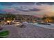 Desert landscaped backyard features fire pit, swimming pool, hot tub and mountain views at 15413 S 31St Pl, Phoenix, AZ 85048