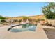 Backyard features a pool with baja step, hot tub, outdoor seating and desert mountain views at 15413 S 31St Pl, Phoenix, AZ 85048