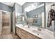 Bathroom boasts a double sink vanity and neutral paint, creating a clean, modern space at 15413 S 31St Pl, Phoenix, AZ 85048