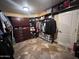 This walk-in closet features custom wood shelving and racks for ample clothing and shoe storage at 15413 S 31St Pl, Phoenix, AZ 85048