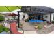 Entertaining backyard featuring a covered patio, an outdoor kitchen, and a ping pong table at 15418 W Surrey Dr, Surprise, AZ 85379