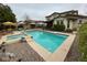Inviting backyard pool and spa, surrounded by a lounge area perfect for outdoor relaxation and entertaining at 15418 W Surrey Dr, Surprise, AZ 85379