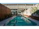 Sparkling pool nestled between modern home and privacy wall at 1621 E Maryland Ave, Phoenix, AZ 85016