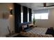 Bedroom featuring a cozy bed, stylish lighting, dark curtains, and soothing ambiance at 1621 E Maryland Ave, Phoenix, AZ 85016