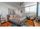 Bright bedroom with a patterned rug, large bed, brick accent wall, and natural light at 1621 E Maryland Ave, Phoenix, AZ 85016