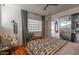 Bright bedroom featuring a comfortable bed, stylish furnishings, and hardwood floors at 1621 E Maryland Ave, Phoenix, AZ 85016