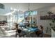 Bright dining area with floor-to-ceiling windows overlooking the outdoor space at 1621 E Maryland Ave, Phoenix, AZ 85016