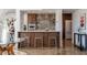 Stylish kitchen featuring a breakfast bar, modern appliances, and ample cabinet space at 1621 E Maryland Ave, Phoenix, AZ 85016